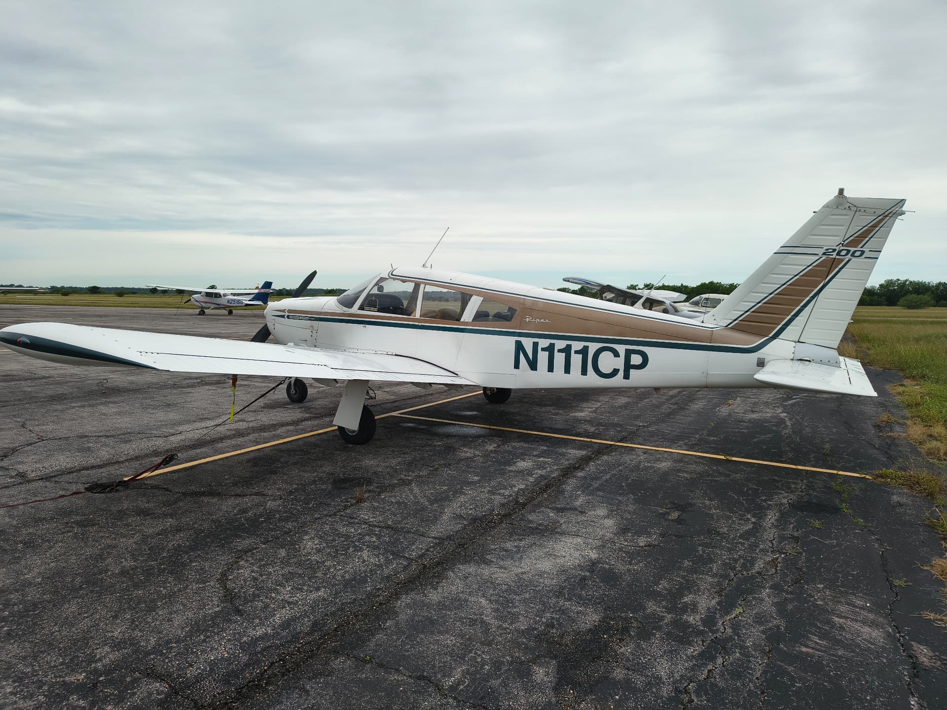 Piper Arrow 200 N111CP parked on the ramp at Lockhart Municipal Airport (50R)